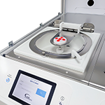 A photograph of a 200mm Apogee® Spin Coater installed in a Cee® X-Pro II Workstation and ready for processing of semiconductor substrates.