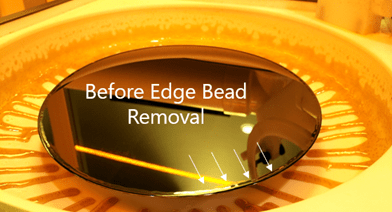 A photograph offered by Cost Effective Equipment showcasing a partially processed semiconductor substrate with edge bead present.