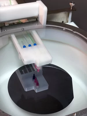 A photograph of the AccuScan™ programmable dispense arm for Apogee® Spin Coaters.